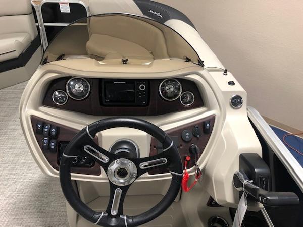 2023 South Bay 224RS LE 2.75 boat dashboard with steering wheel and control panel.