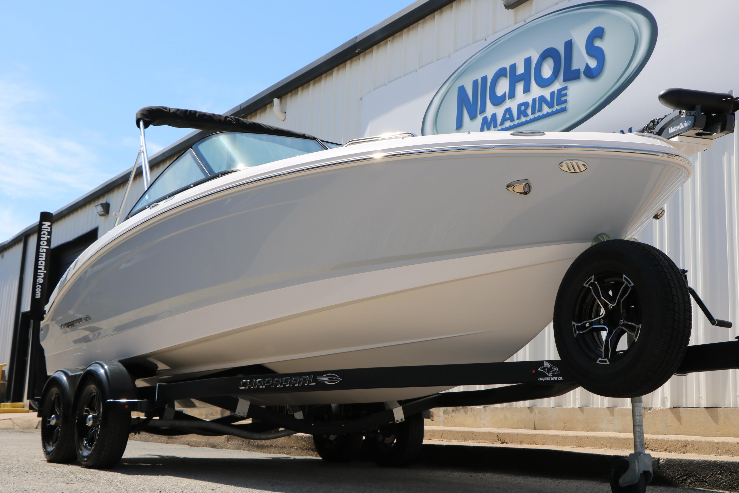 2025 Chaparral 21 SSi Ski & Fish boat on trailer at Nichols Marine dealership.