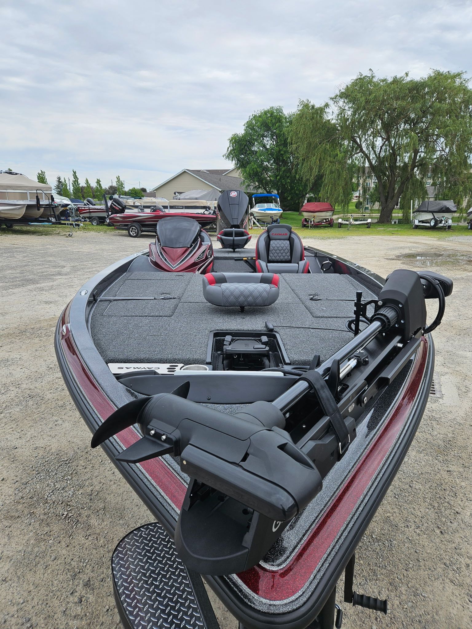 Caymas CX 21 PRO 2027 on a lot with boats.