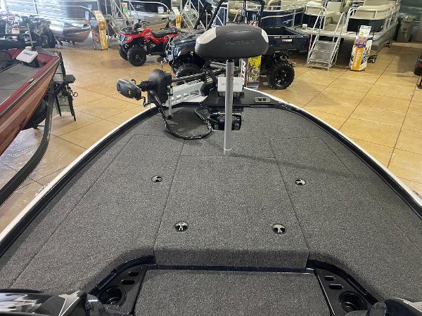 2025 Nitro Z18 Pro boat interior with gray carpet and seating in showroom.