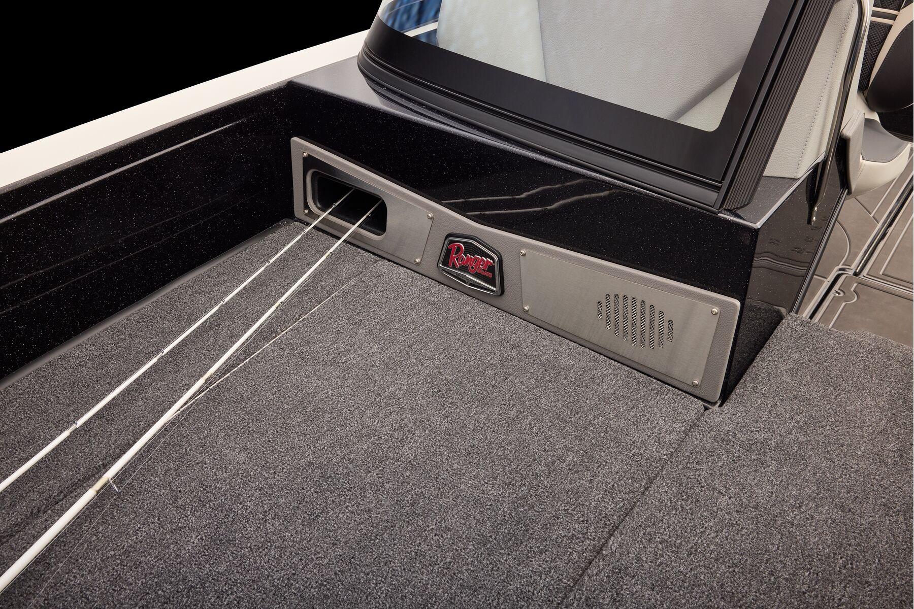 Manufacturer Provided Image: 2026 Ranger 620xFS Pro boat interior with rod storage and carpeted deck.