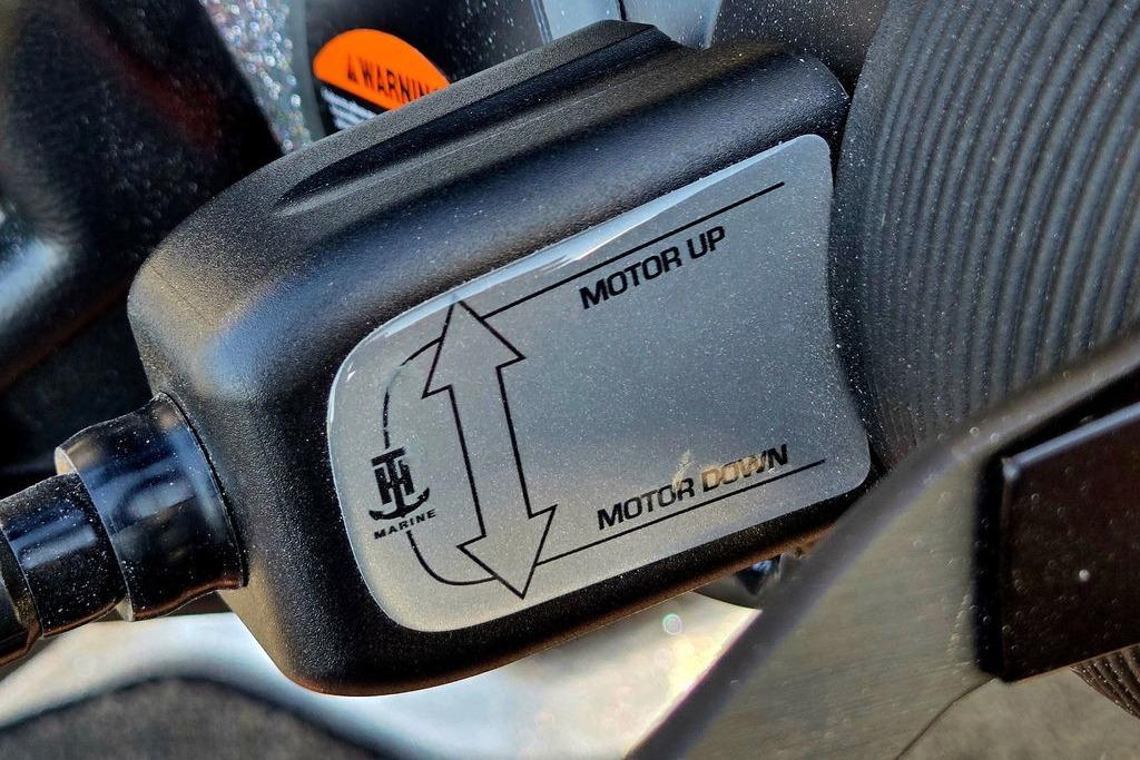 Close-up of Skeeter ZXE20 motor control panel, showing "Motor Up" and "Motor Down" options.