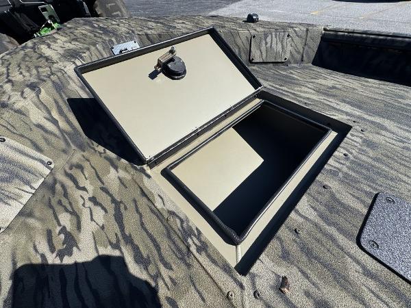 2025 SeaArk 1752 Slayer Pro boat with open storage compartment, camo design.