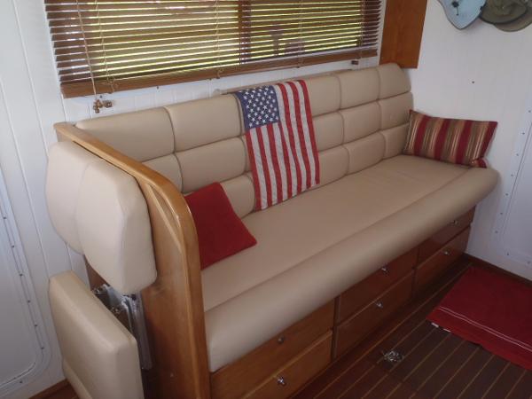 Luxurious beige sofa with American flag pillow in 2025 Great Harbour N40 yacht interior.