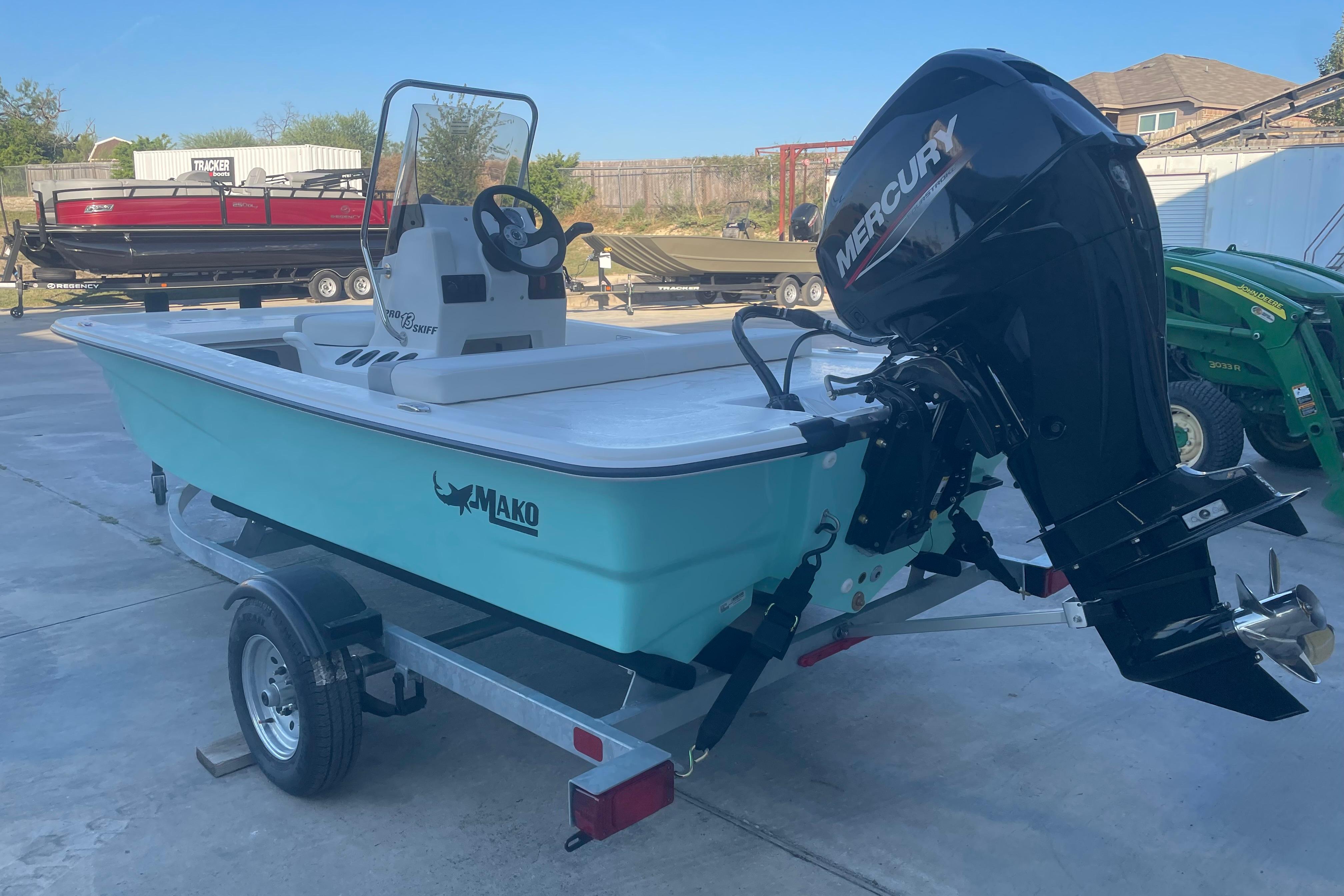 2026 Mako Pro Skiff 13 CC boat with Mercury engine on trailer.