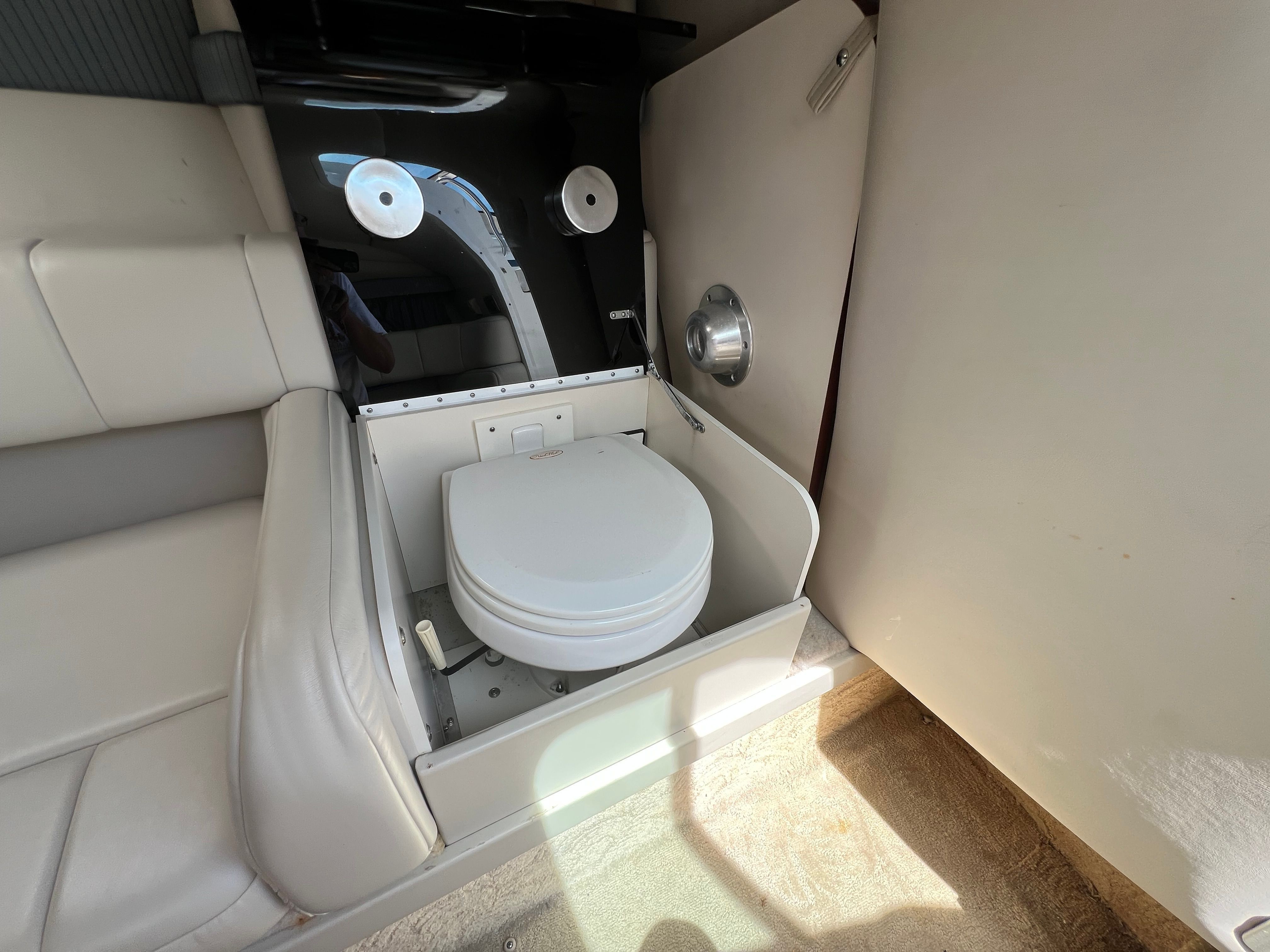 The image shows a toilet in the cabin of a 2005 Formula 260 Sun Sport boat.