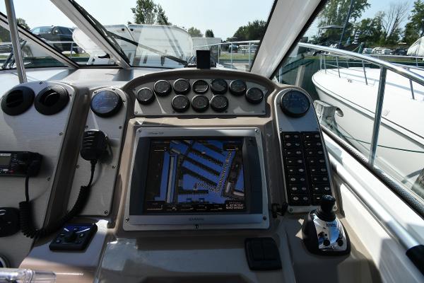 Dashboard of 2010 Cruisers Yachts 390 Sports Coupe with navigation system and controls.