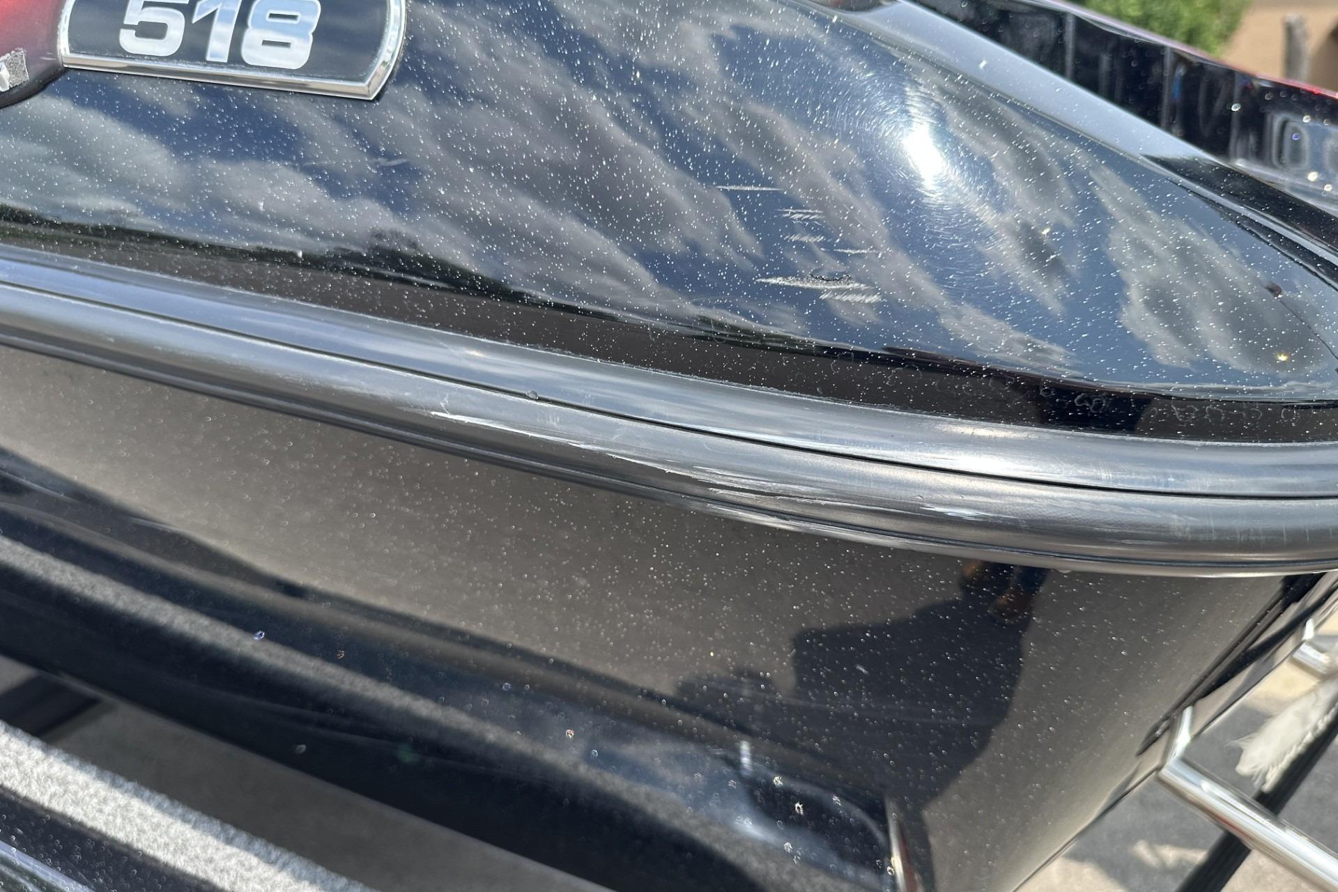 2018 Ranger Z518 boat hull with reflective black finish and model badge.