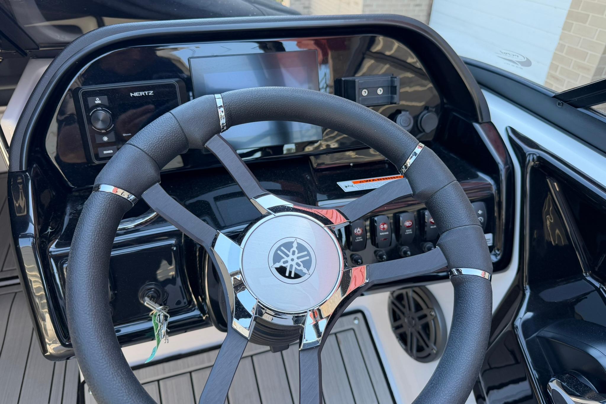 2024 Yamaha Boats AR190 dashboard with steering wheel and control panel.