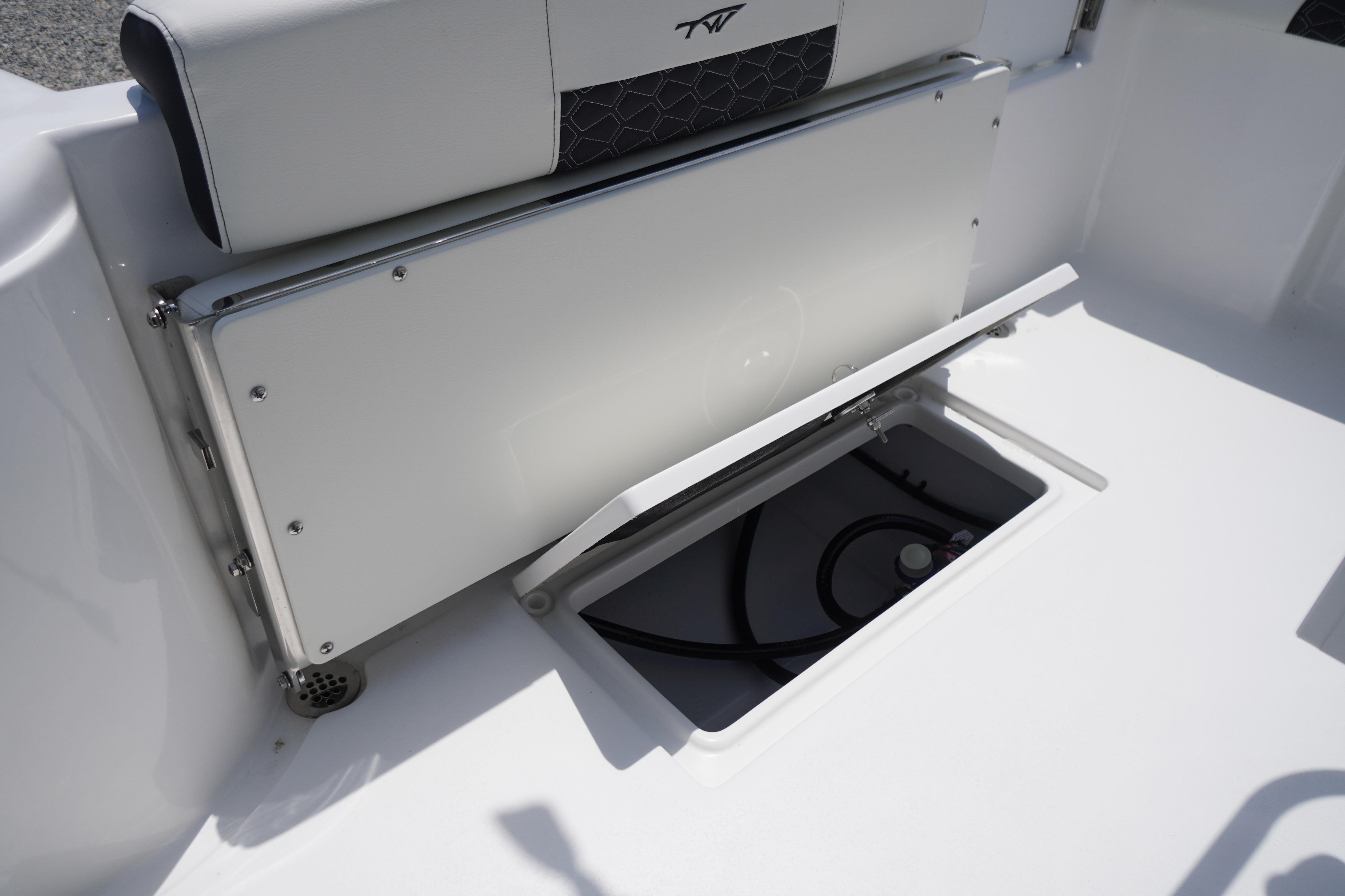 2027 Tidewater 220 CC Adventure boat storage compartment with open hatch and visible interior.