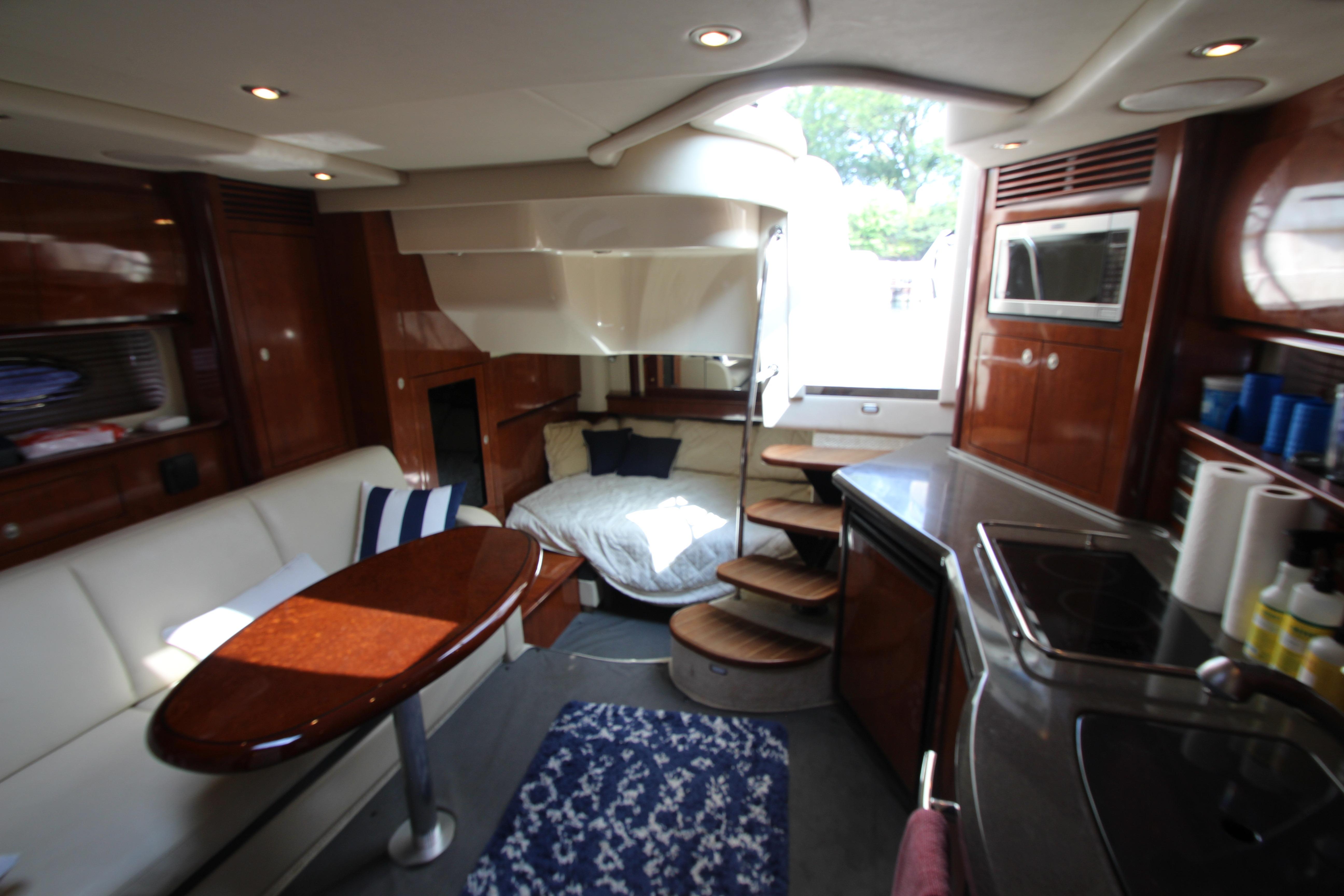 Luxurious interior of 2004 Sea Ray 40 Sundancer yacht with modern amenities and cozy seating.