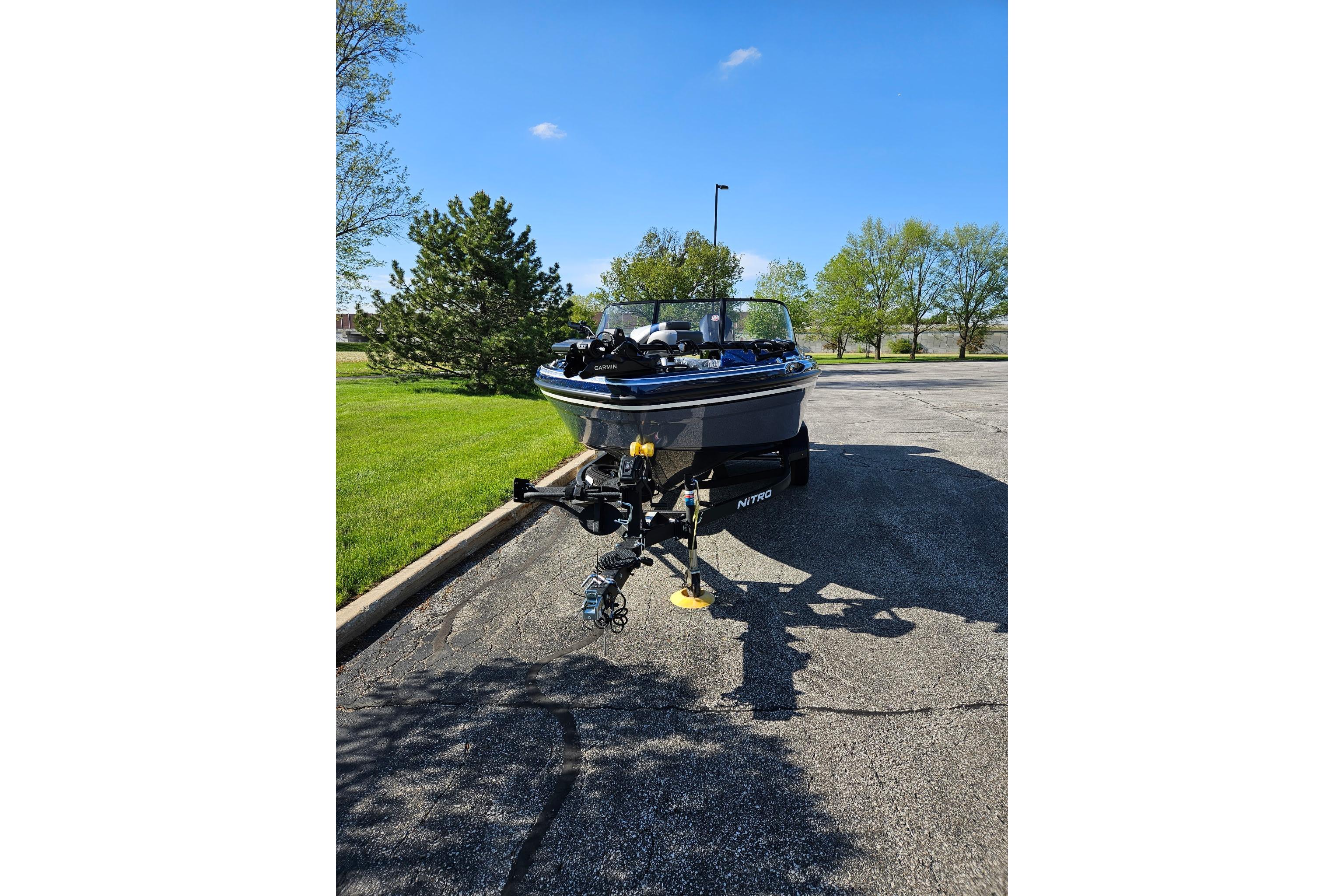 2026 Nitro ZV19 Sport Pro boat on trailer in sunny parking lot.
