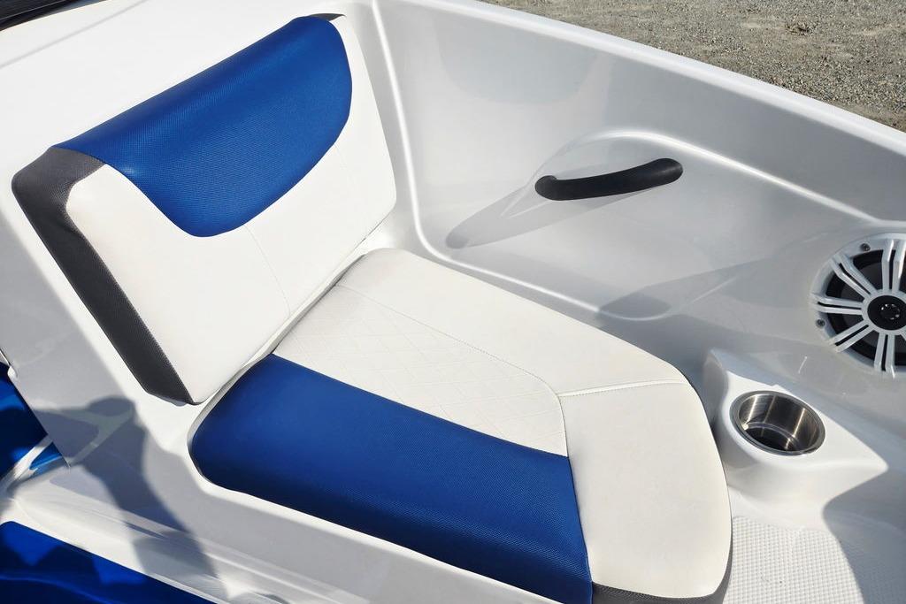 Blue and white seating on 2018 Tahoe 450 TS boat, featuring cup holder and speaker.