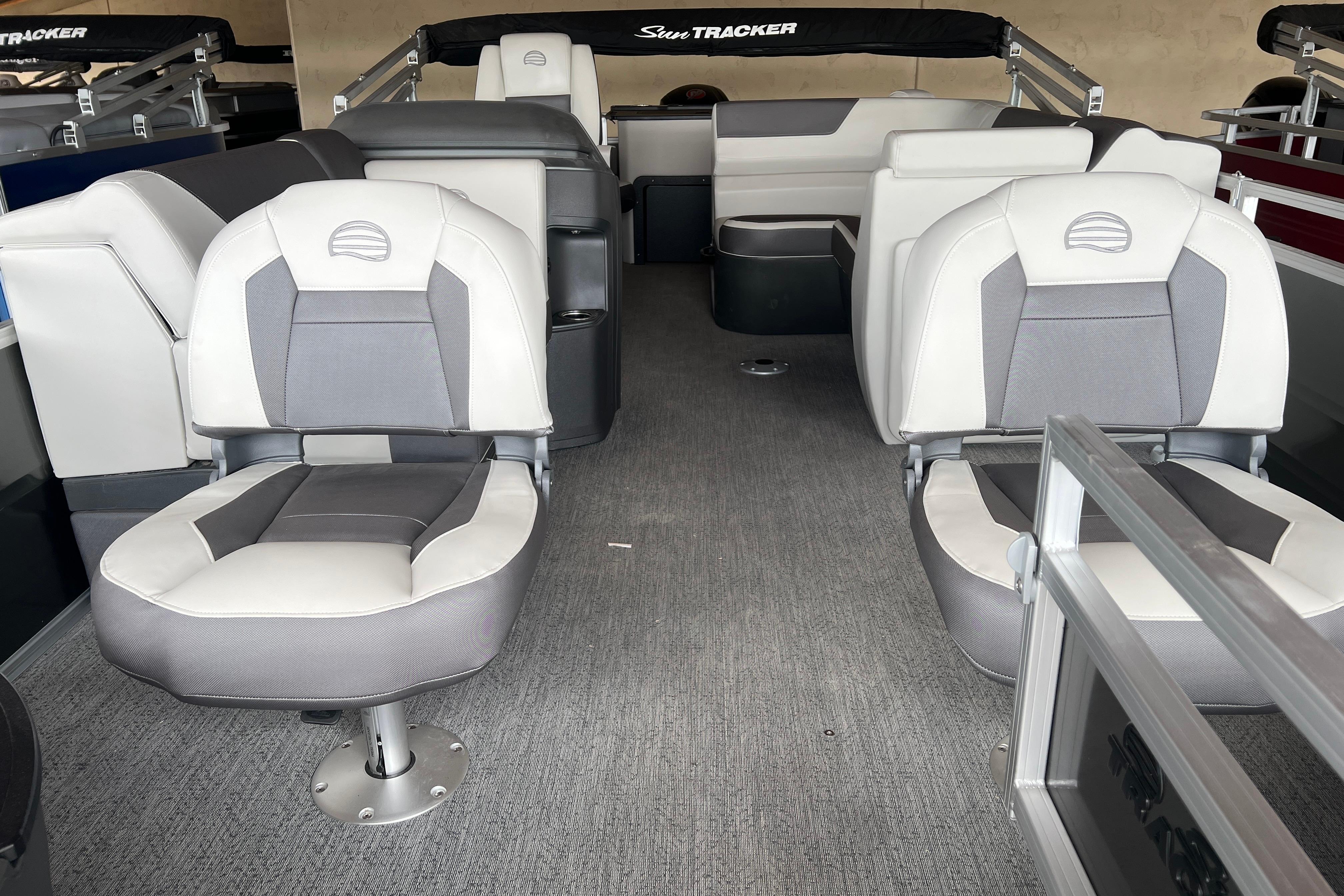 Interior of 2026 Sun Tracker Fishin' Barge 20 DLX with comfortable seating.