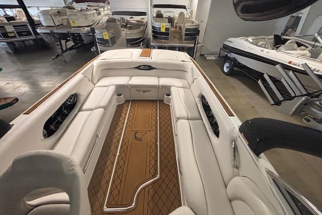 Interior of a 2012 Centurion Enzo SV244 boat with white seating and wood accents.