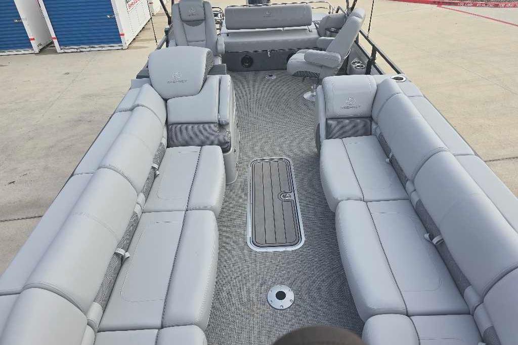 2025 Regency 250 LE3 Sport pontoon boat with spacious gray seating and modern design.