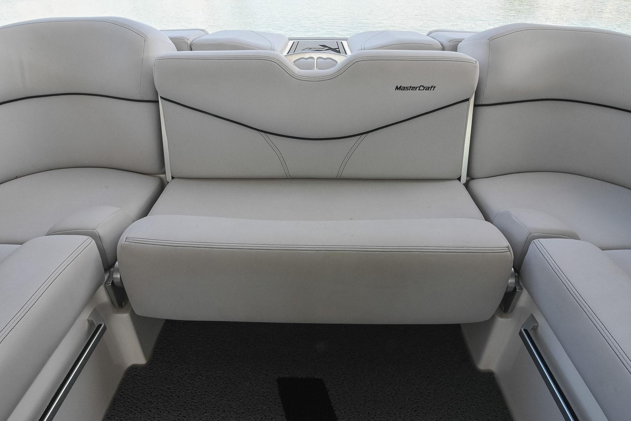2018 MasterCraft X23 boat interior with luxurious white seating.