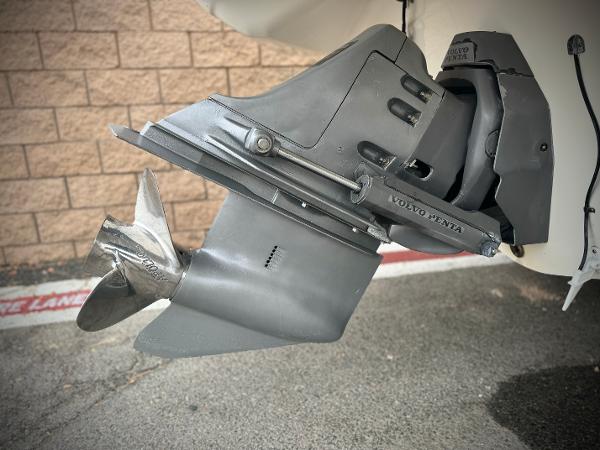 2006 Larson LXi 248 boat propeller and outdrive close-up.