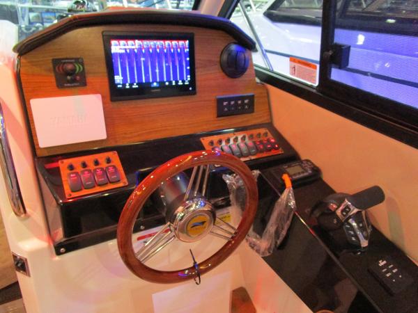 2025 Cutwater C-248 Coupe helm with modern controls and navigation display.