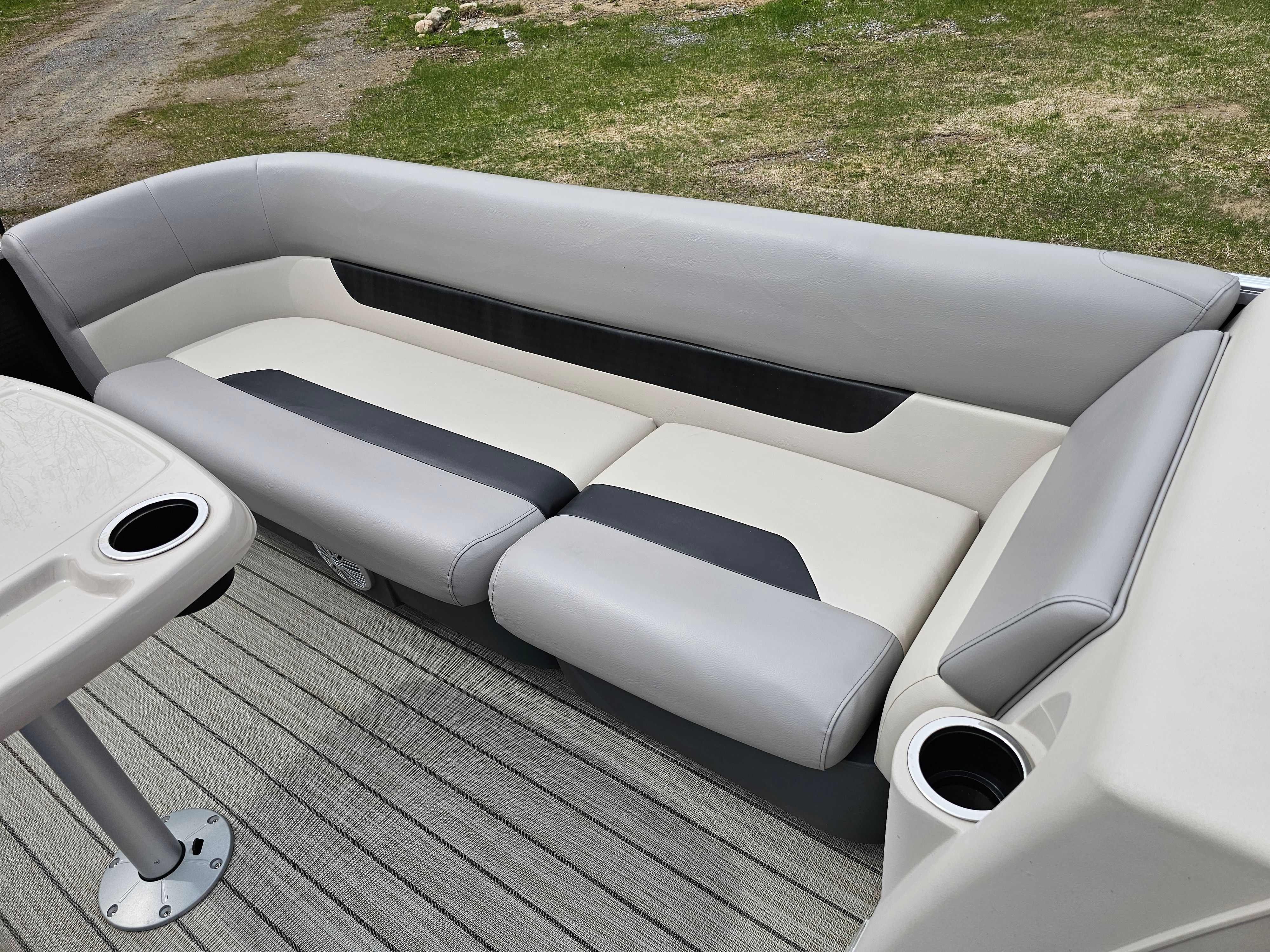 Interior of 2021 Princecraft Vectra 23XT with gray and white seating.