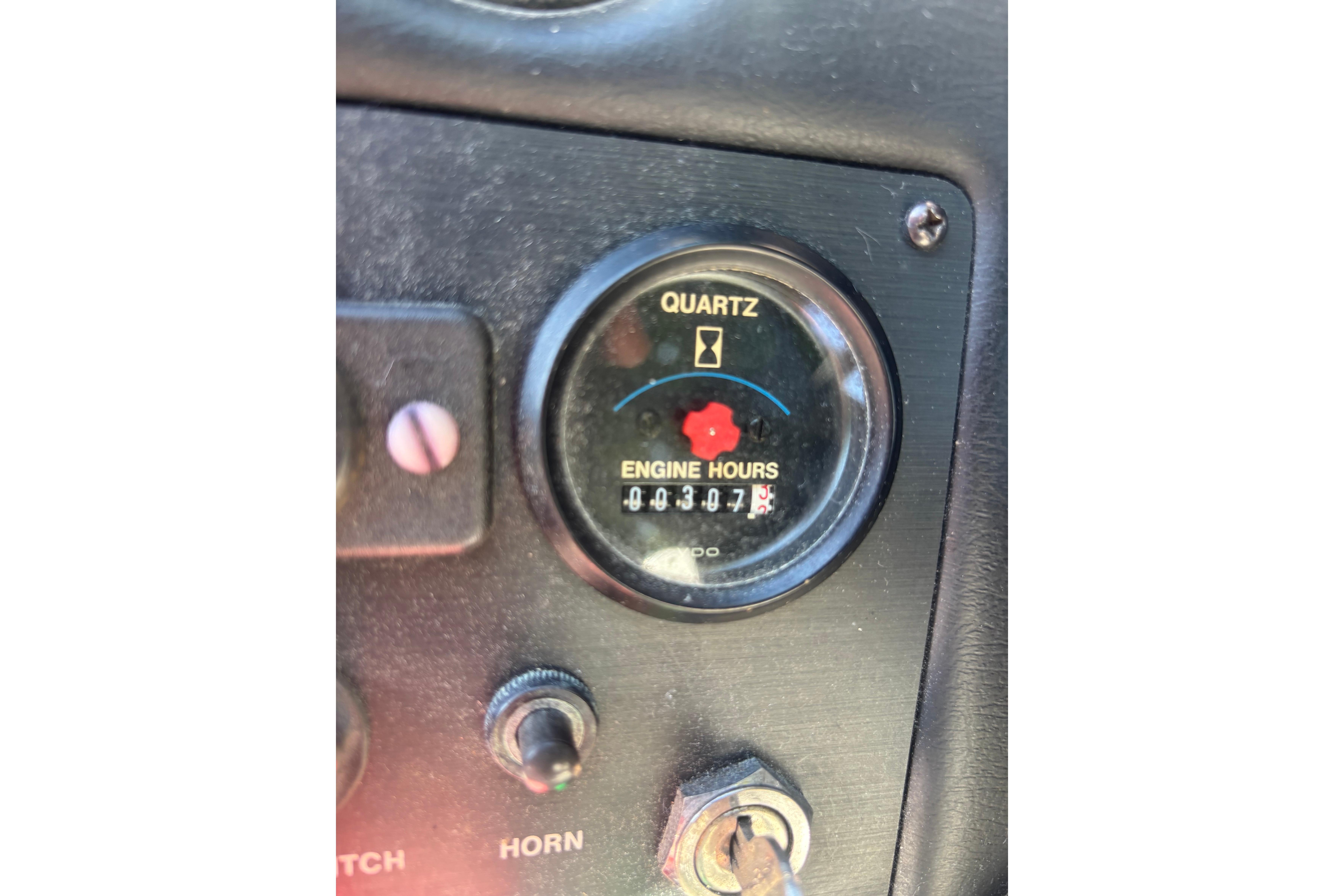 Dashboard of a 1990 MasterCraft ProStar 190 showing engine hours.