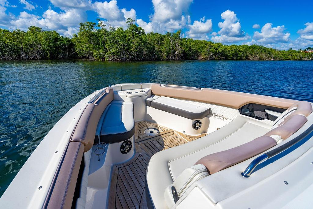 2019 Sea Ray SLX 400 Outboard boat interior with luxurious seating, on a sunny day.
