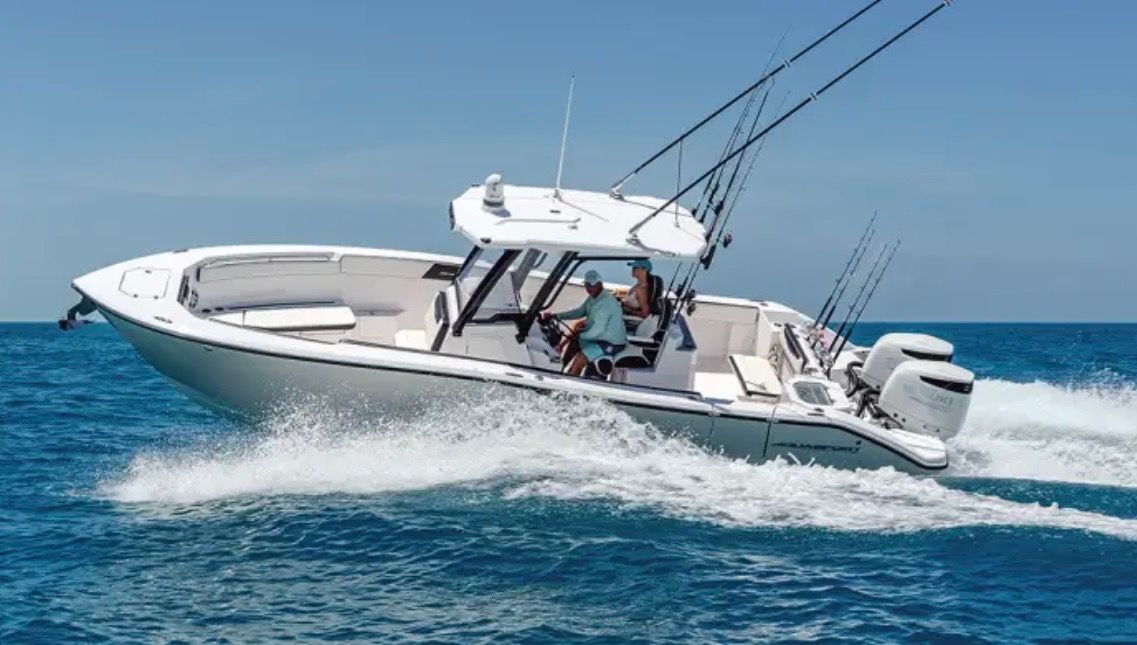 2025 Aquasport 28AS boat cruising on the ocean.
