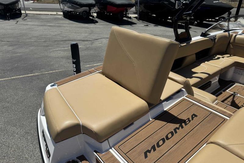 2023 Moomba Mojo Pro boat with tan seating and Moomba branding on deck.
