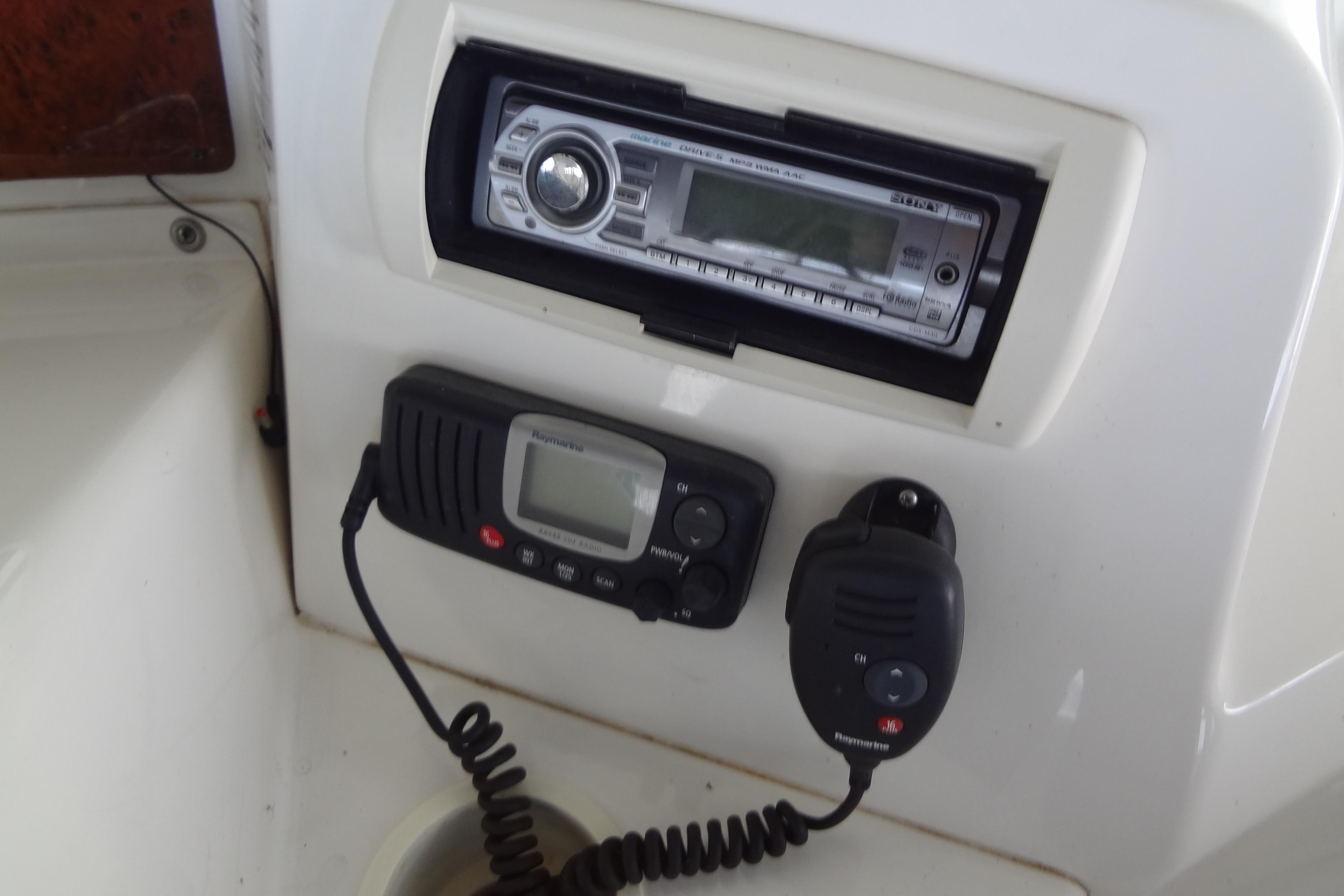 Control panel of a 2005 Silverton 34 Convertible boat with radio and communication devices.