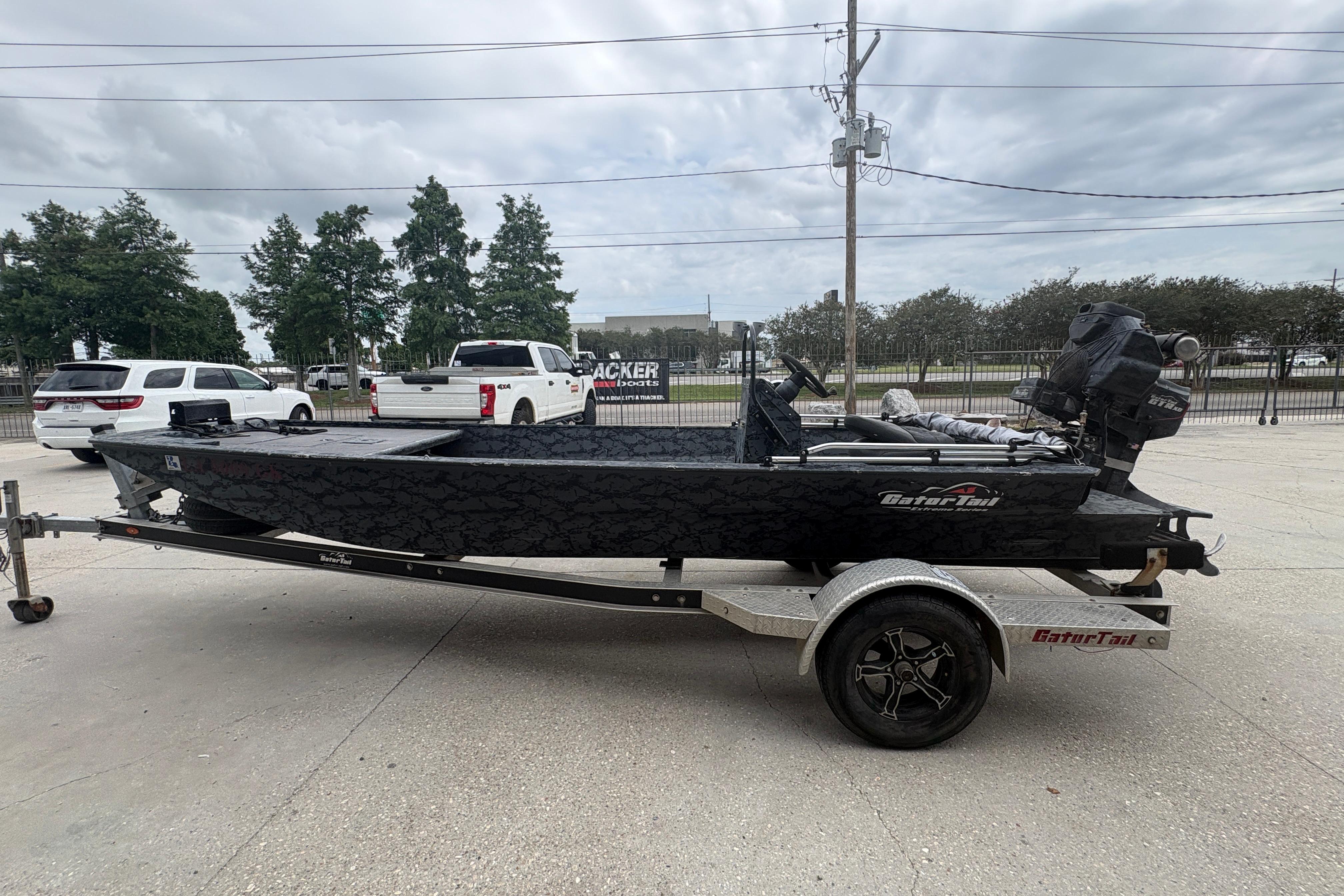 2020 Gator Tail Extreme boat on trailer, parked outdoors with overcast sky.