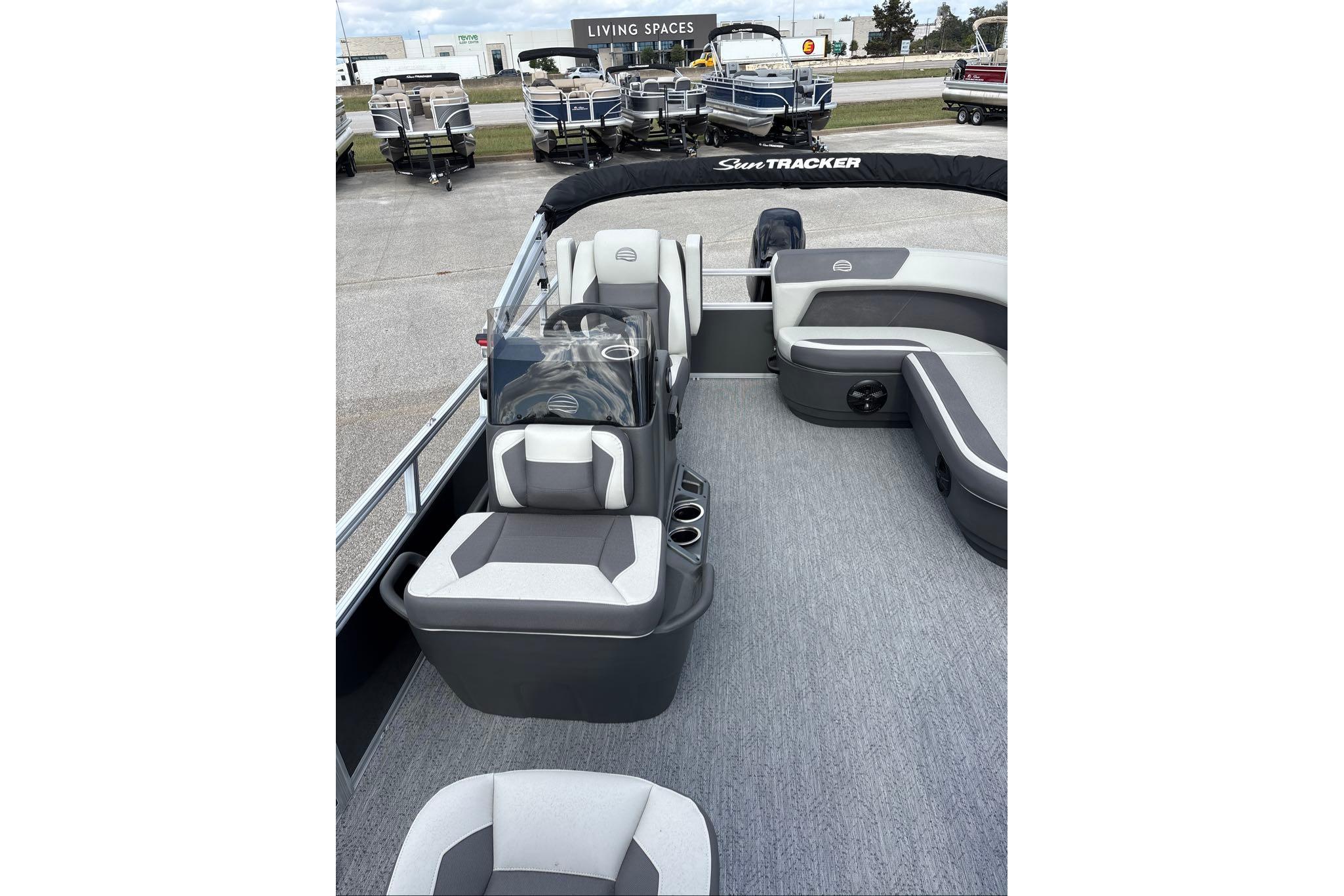 2026 Sun Tracker Bass Buggy 16 XL Select pontoon boat interior with seating and console.
