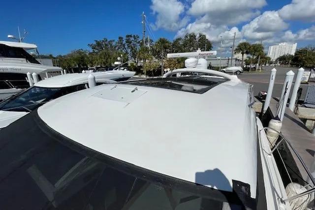 2016 Sea Ray Sundancer 510 yacht docked under a clear blue sky.