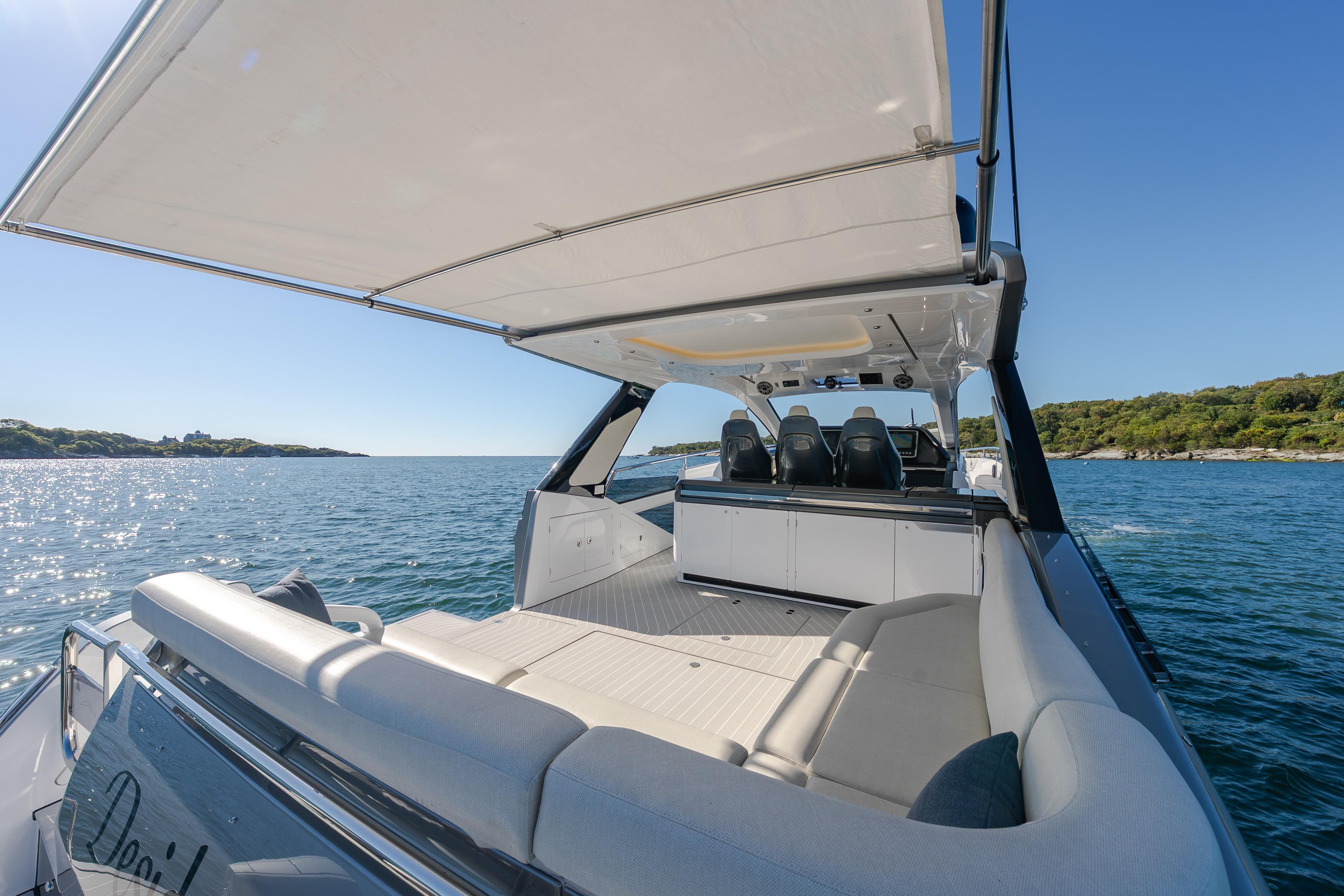 2023 Azimut Verve 47 luxury yacht cruising on a sunny day, featuring spacious seating and sleek design.