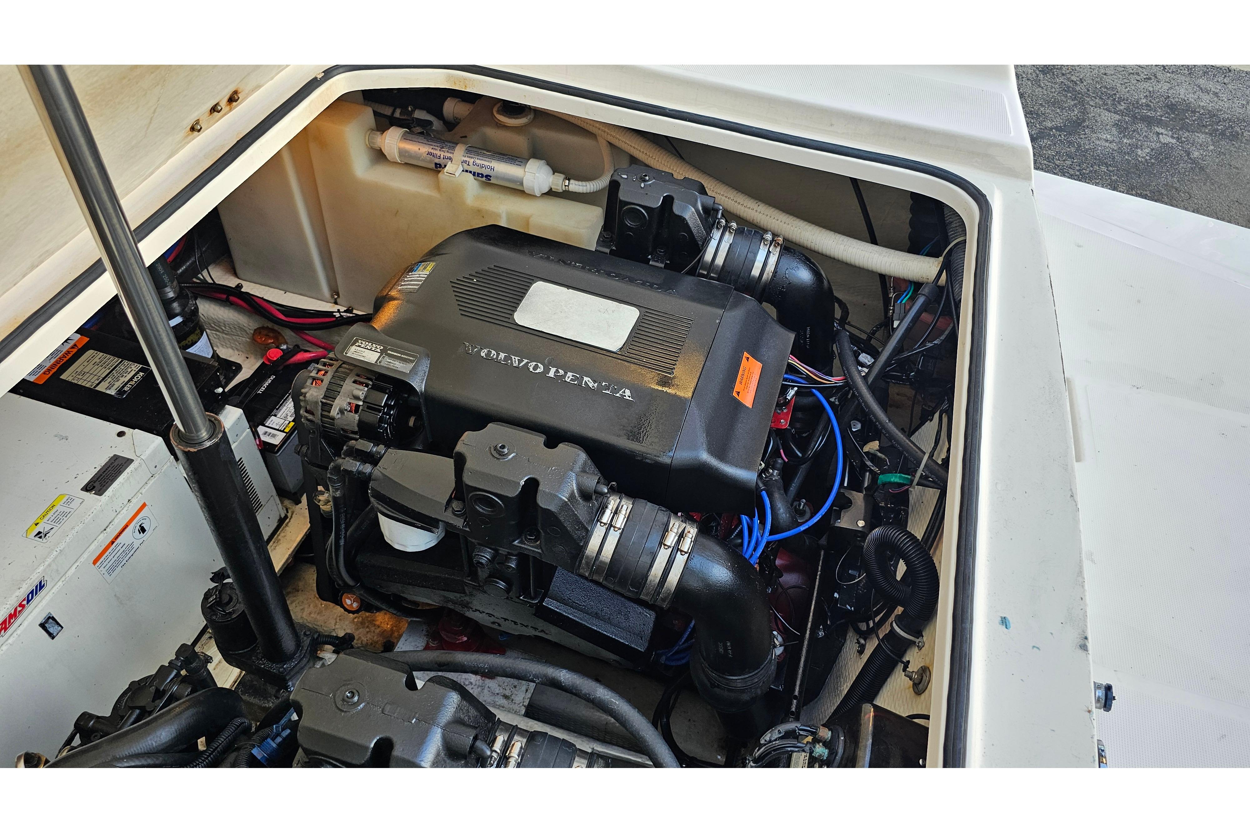 Engine compartment of a 2005 Regal 3060 Window Express boat, featuring a Volvo Penta engine.