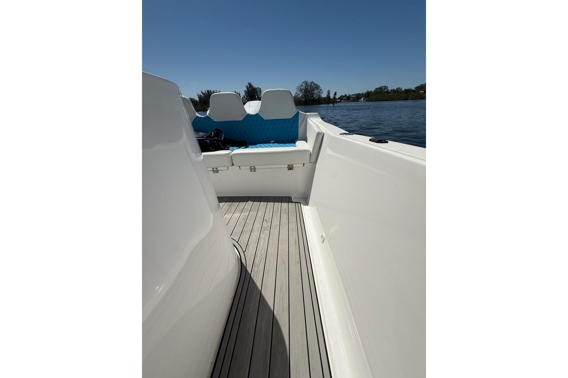 Custom Infusion 34 CC boat interior, 2021 model, featuring sleek white design and blue seating.