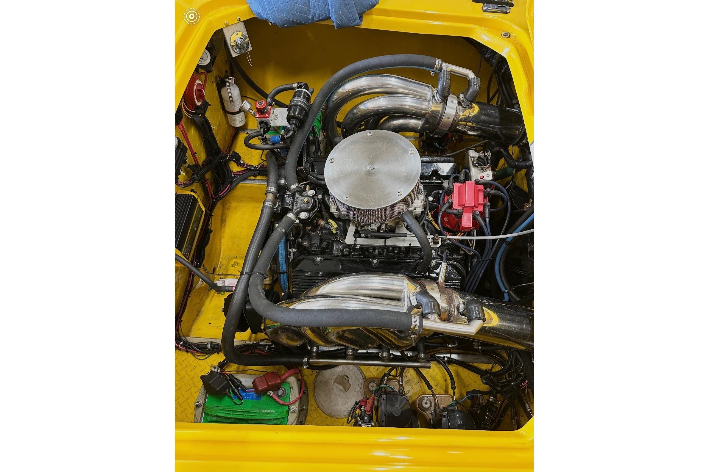 Engine compartment of a 2004 Donzi 22 Classic boat, showcasing detailed components.
