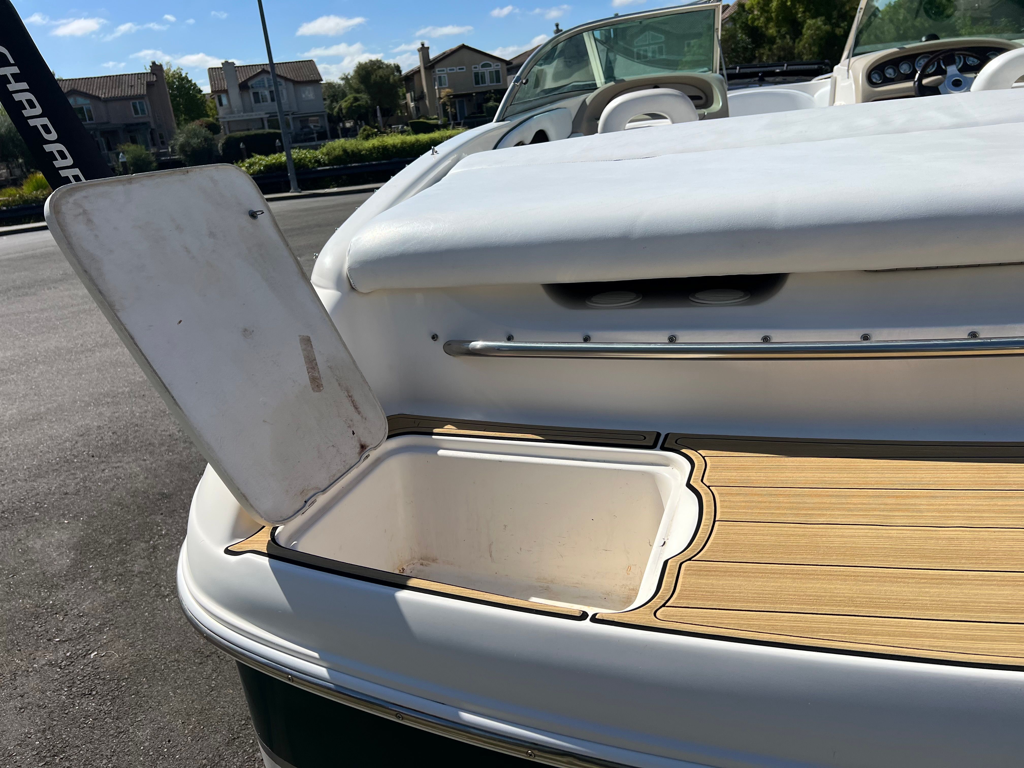 Open storage compartment on a 2001 Chaparral 216 SSi boat.