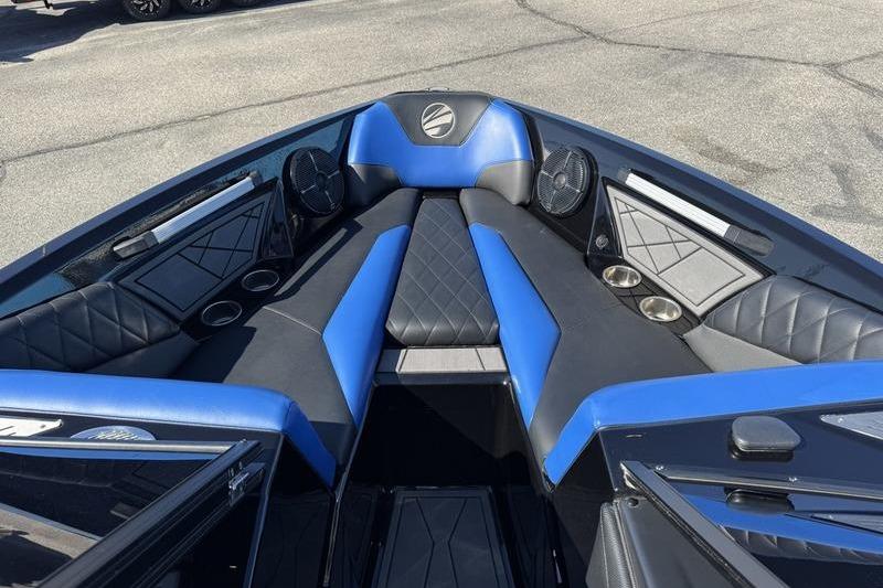2022 Tigé Z3 boat interior with blue and black seating, cup holders, and speakers.