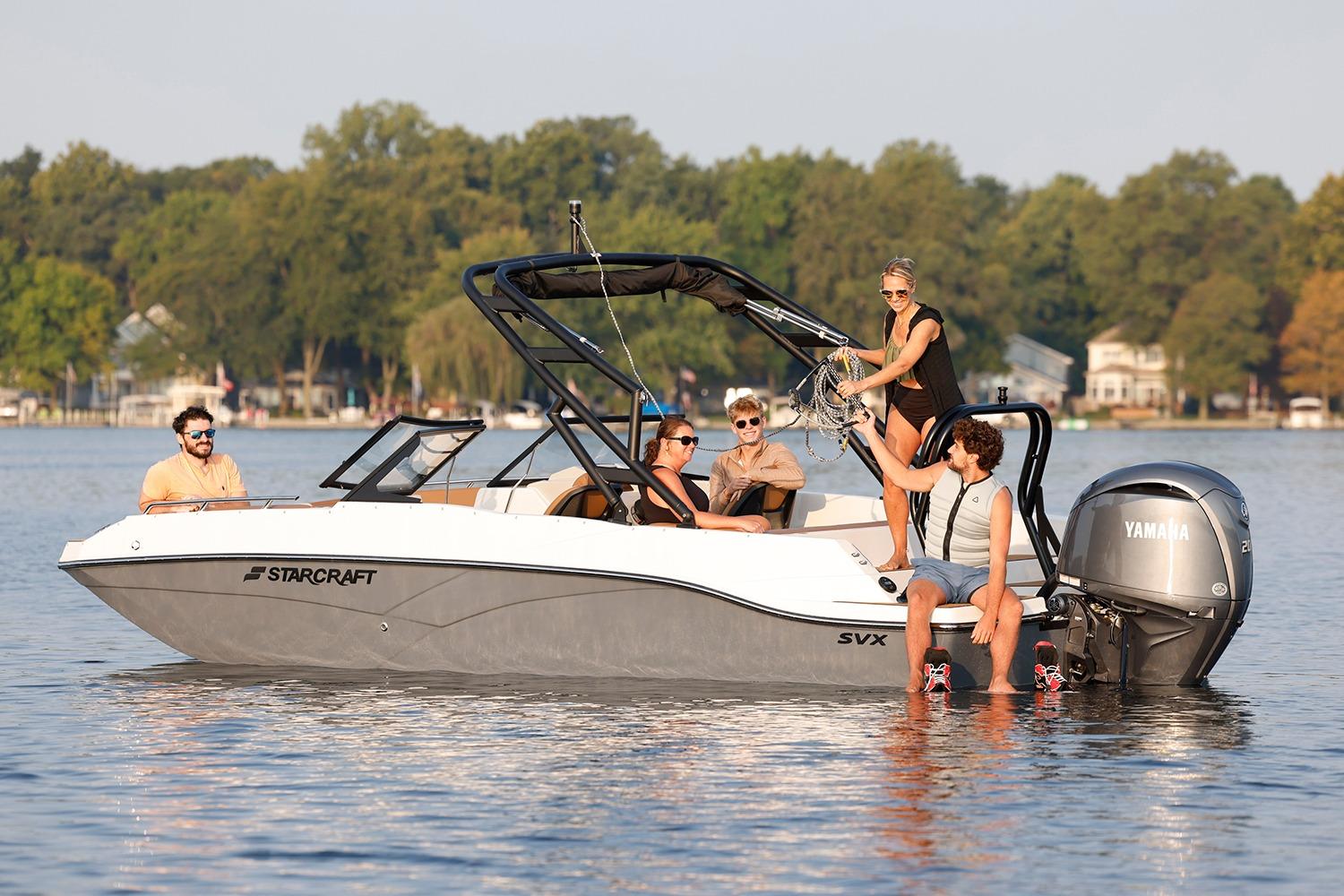 Manufacturer Provided Image: 2026 Starcraft SVX 210 DC OB boat with people enjoying a sunny day on the water.