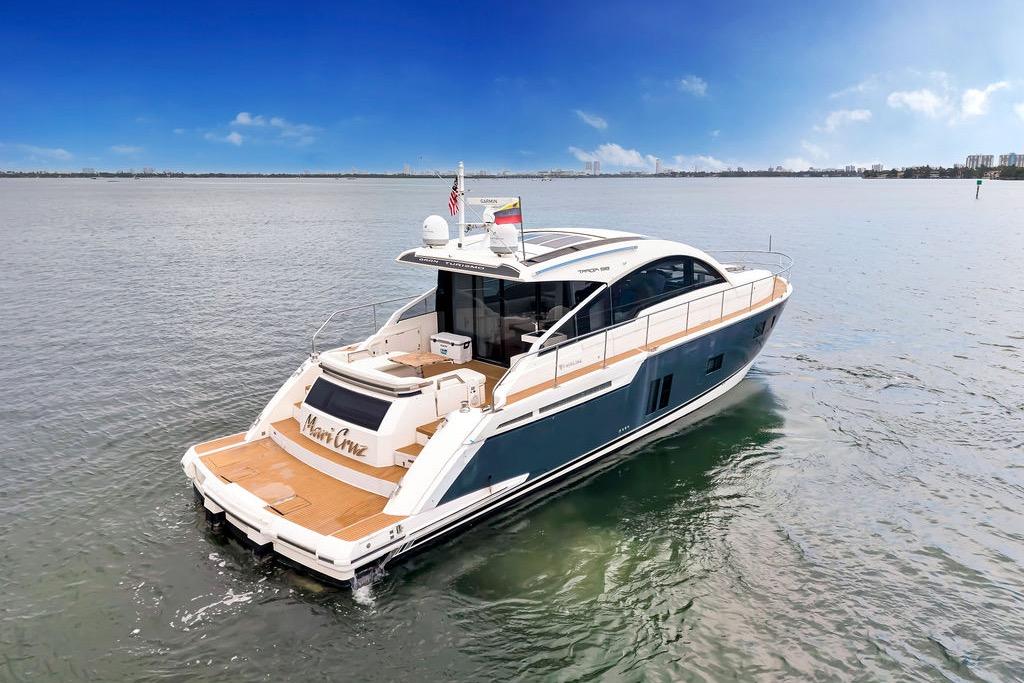 2012 Fairline Targa 58 yacht cruising on calm waters under a clear blue sky.