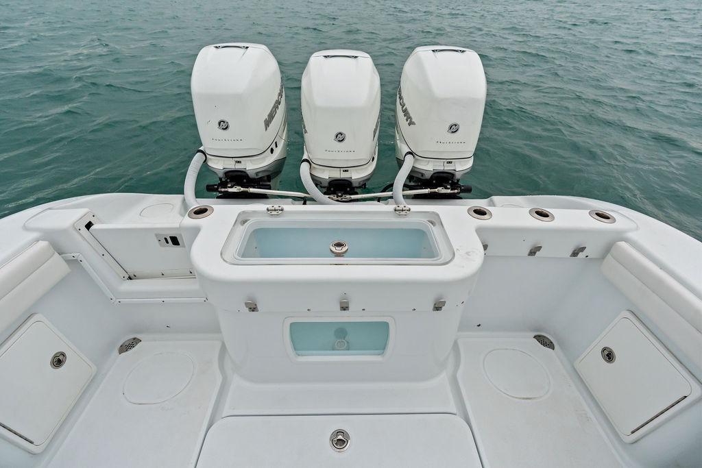 2021 Yellowfin 36 Offshore boat with triple Mercury outboard engines on open water.