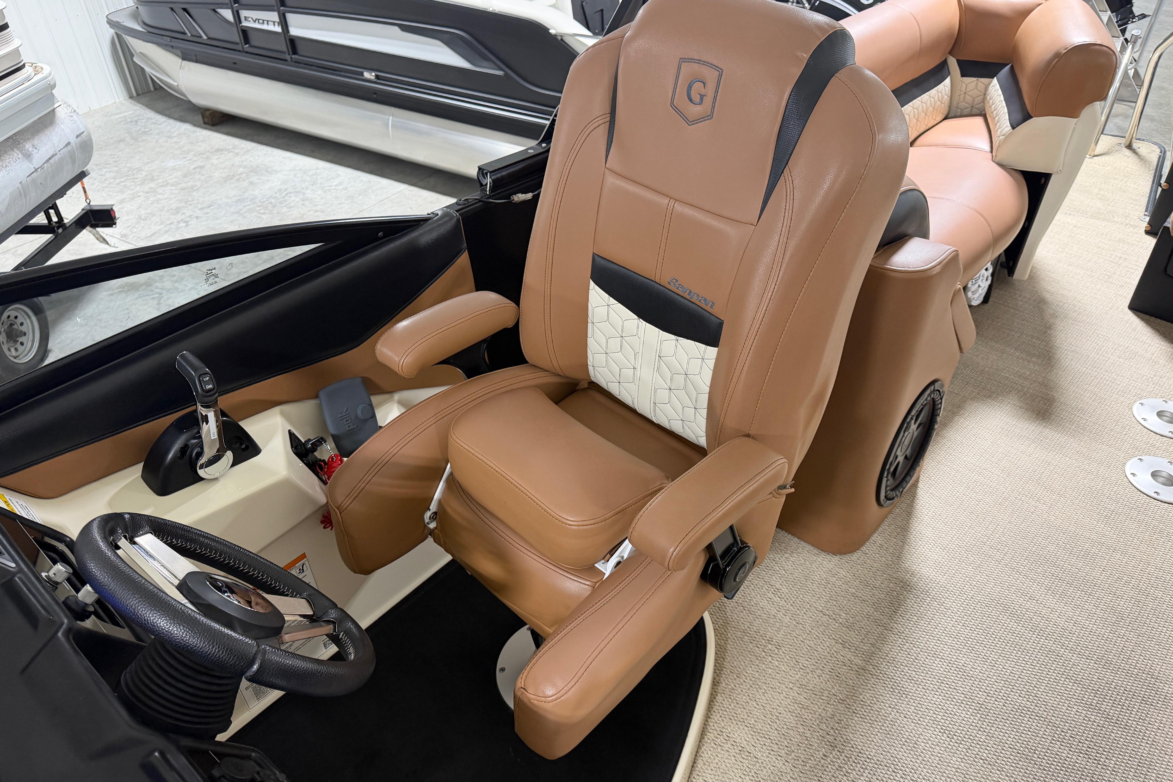 Captain's chair and helm of 2018 Godfrey Sanpan 2500 ULC pontoon boat.