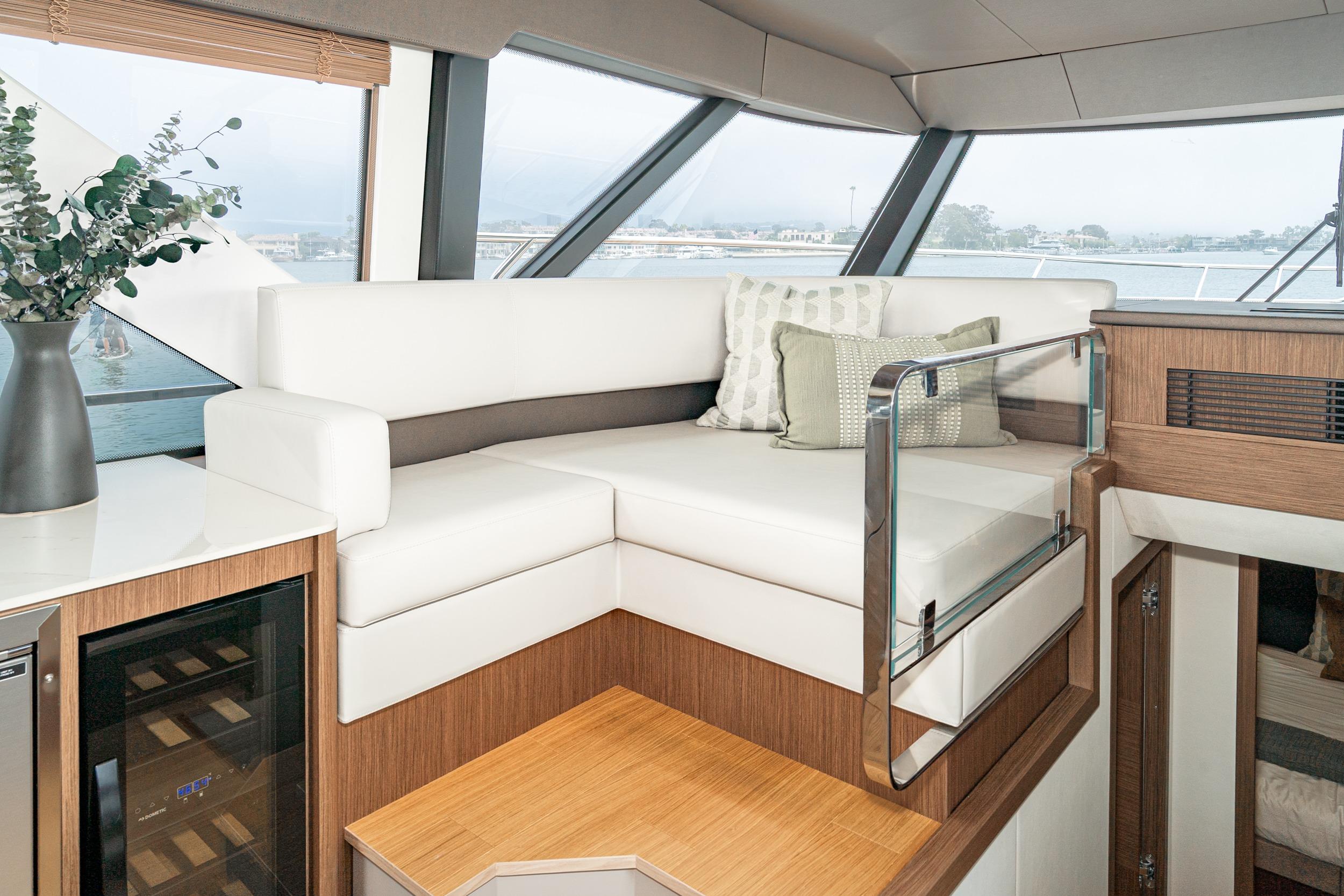 Luxurious interior of 2024 Prestige X60 yacht with elegant seating and modern design.
