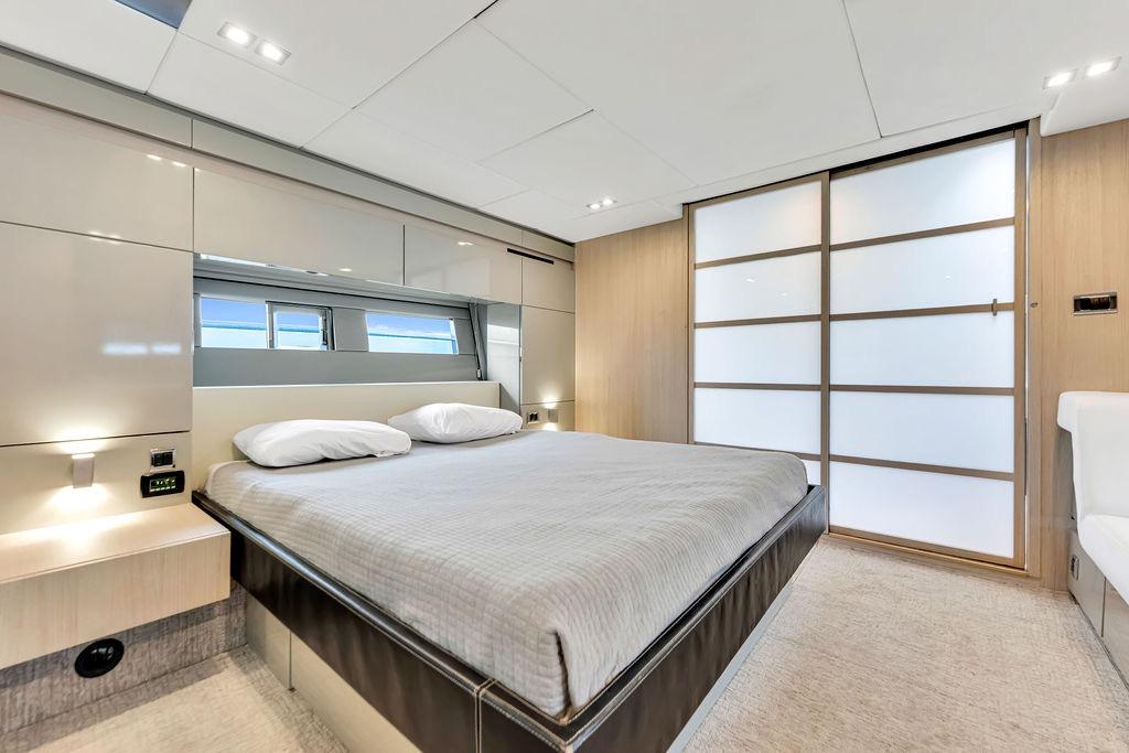 Luxurious bedroom interior of 2012 Fairline Targa 58 yacht with modern design.