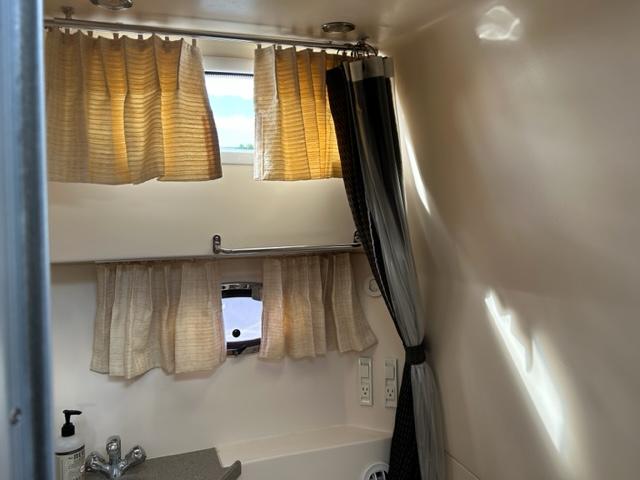 2010 Regal 3060 Window Express bathroom with curtains and sink.