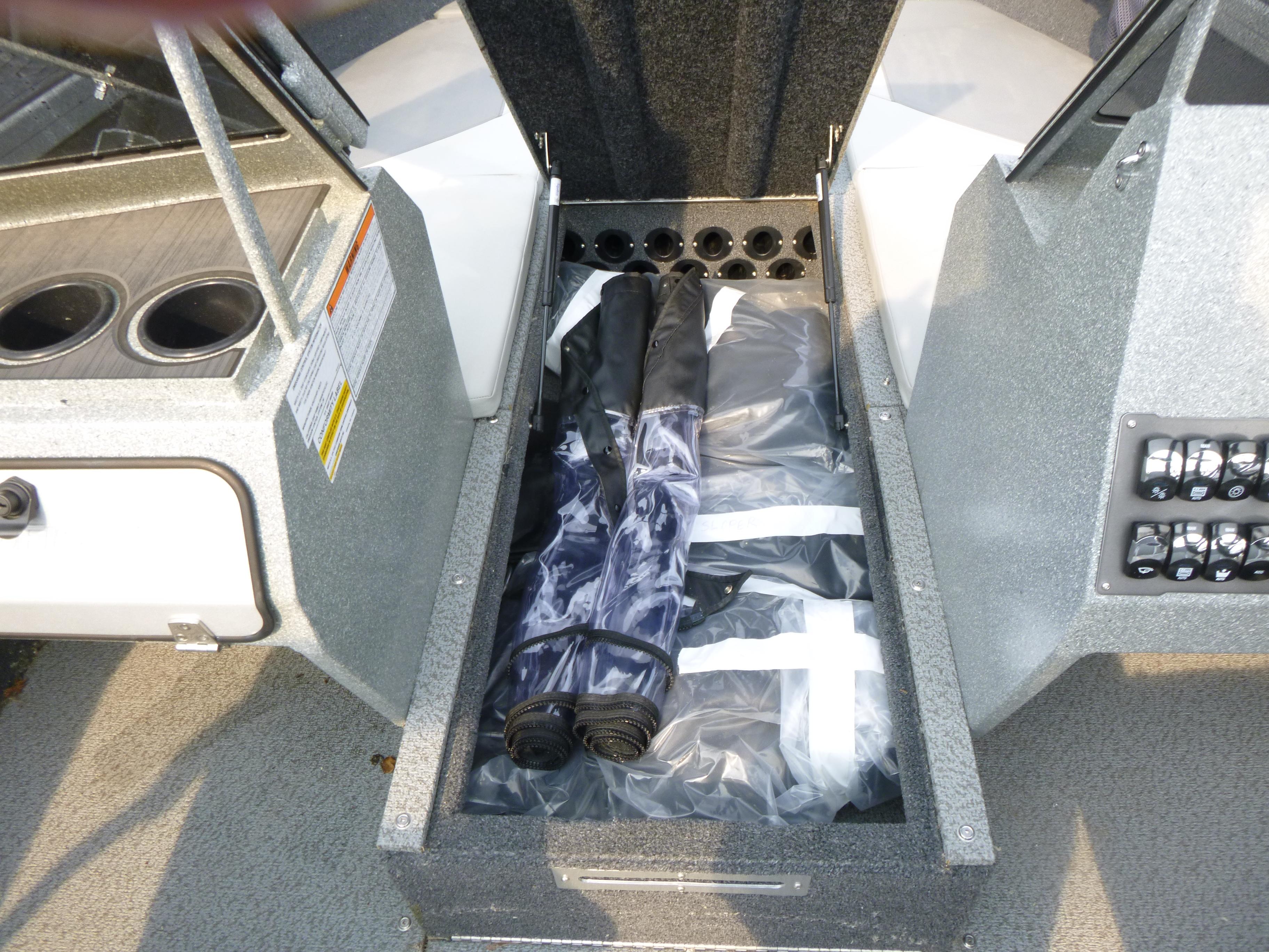Storage compartment in 2025 KingFisher 2125 Arrow Sport boat, featuring organized gear.
