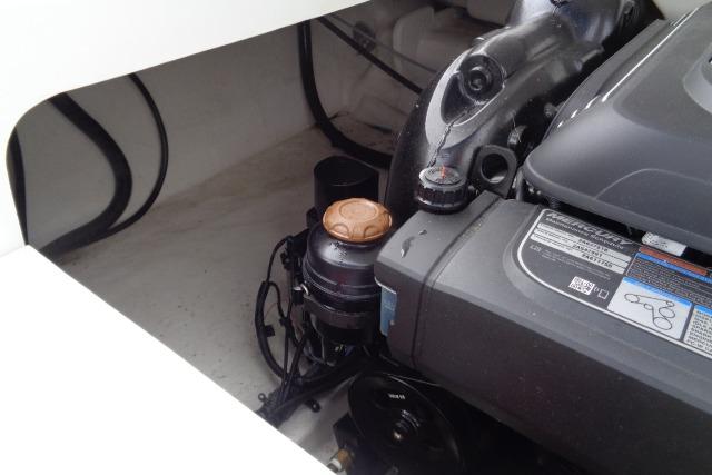 Engine compartment of 2019 Monterey 218SS Super Sport boat, showcasing mechanical components.