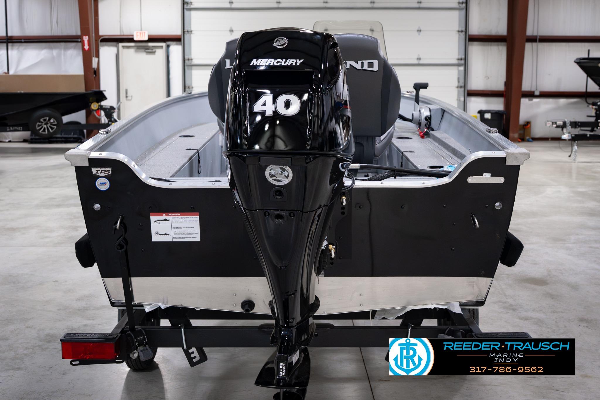 2026 Lund 1600 Fury SS boat with Mercury 40 engine in showroom.