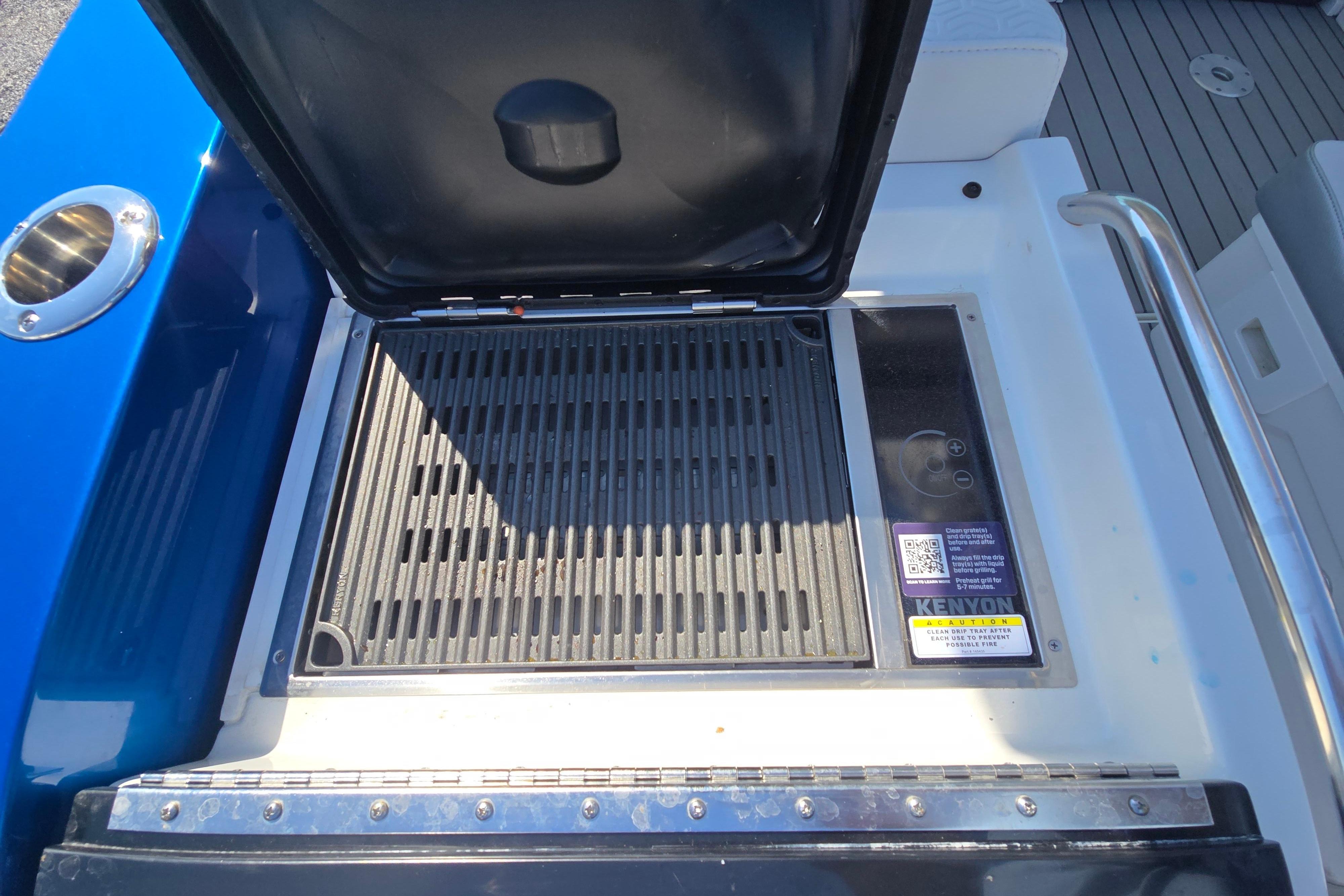 2025 Formula 380 Super Sport Crossover OB boat grill and storage compartment.