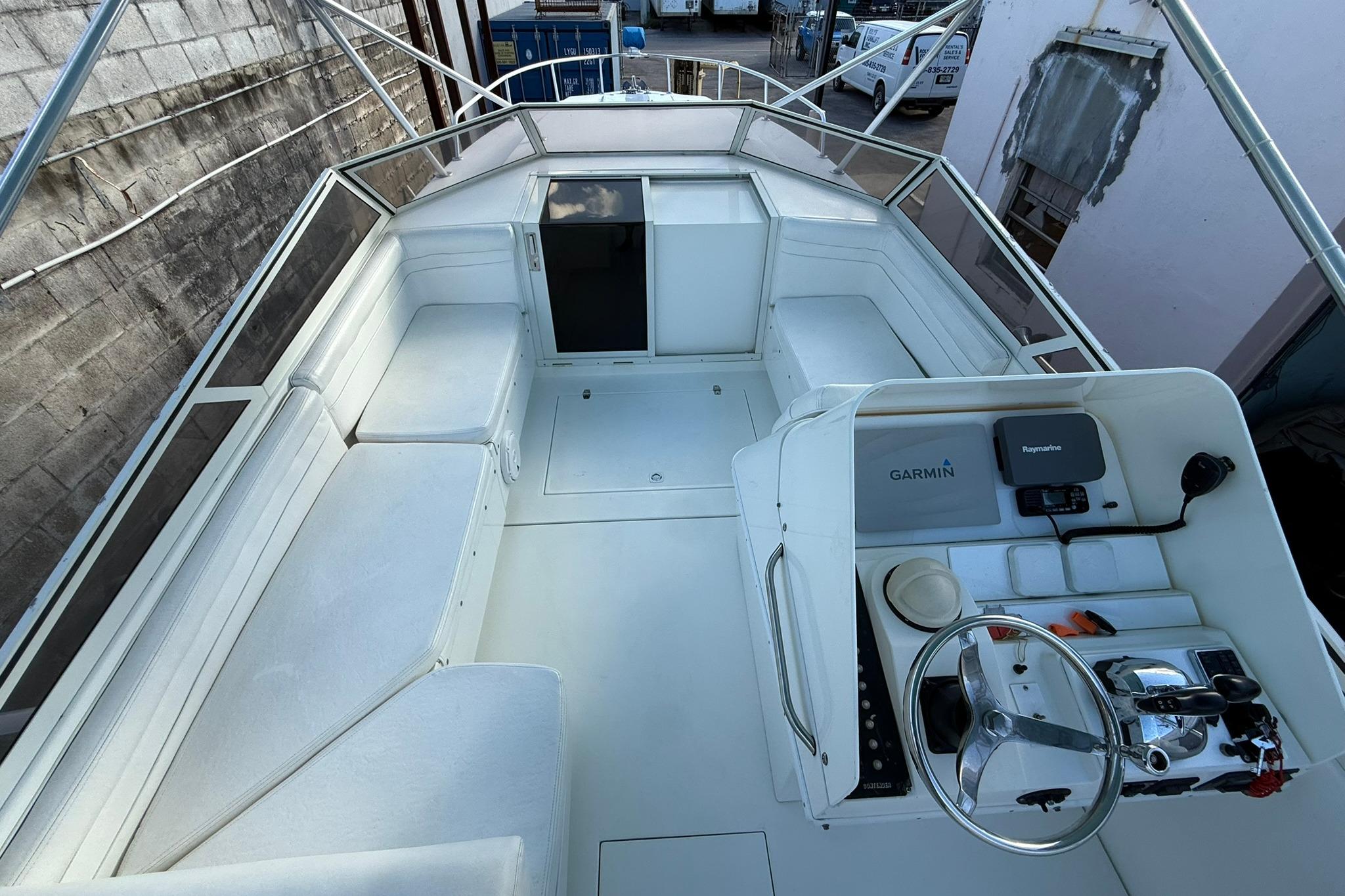 1998 Contender 35 Express boat interior with helm, seating, and navigation equipment.